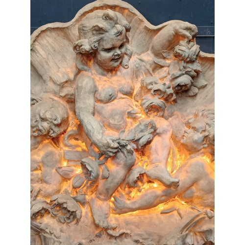 249 - Large ornate wall mounted fibreglass plaque depicting musical cherubs. {H150cm x W 232cm x D 36cm }.