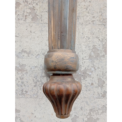 253 - Pair of bronze wall sconces with white plastic shades in the form of torches. {H 160cm x W 40cm x D ... 