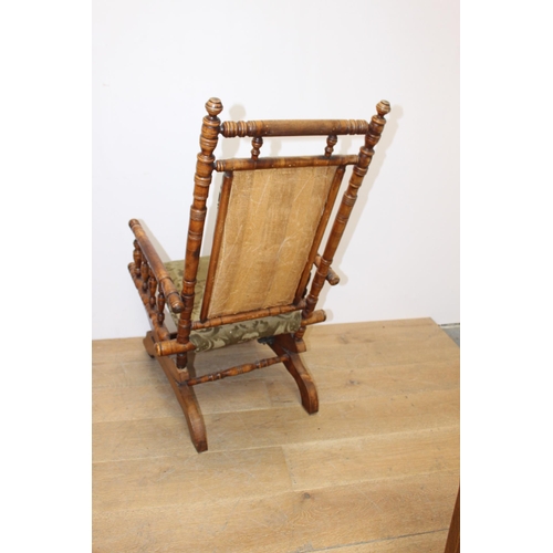 256 - Late 19th. C. American rocking chair with upholstered seat. {H 103cm x W 54cm x D 52cm }.