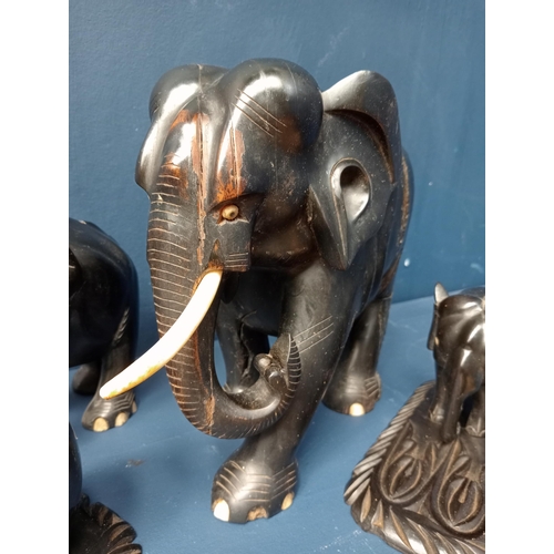 278 - Figural group of wooden elephants. {H 22cm down to H 10cm }.