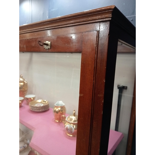 302 - Mahogany glazed shop cabinet with three graduated shelves. {H 183cm x W 154cm x D 40cm }.