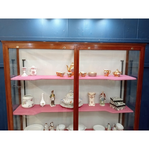 302 - Mahogany glazed shop cabinet with three graduated shelves. {H 183cm x W 154cm x D 40cm }.