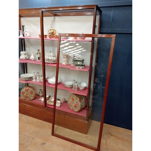 302 - Mahogany glazed shop cabinet with three graduated shelves. {H 183cm x W 154cm x D 40cm }.