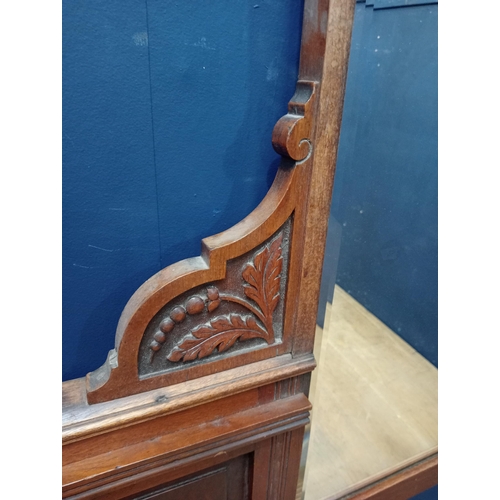 308 - Edwardian mahogany overmantle with bevelled glass and leaf decoration. {H 84cm x W 176cm x D 9cm }.