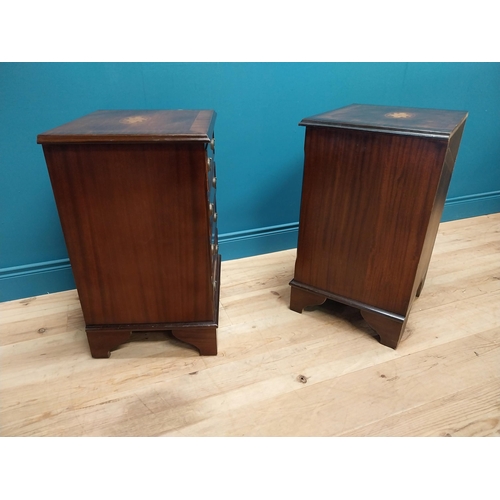 327 - Pair of good quality mahogany and satinwood inlaid bedside cabinets with four drawers raised on brac... 