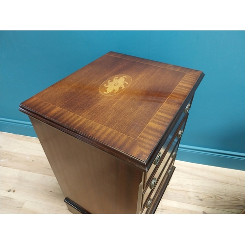 327 - Pair of good quality mahogany and satinwood inlaid bedside cabinets with four drawers raised on brac... 