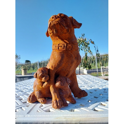 330 - Cast iron model of Pug dog with pups. {30 cm H x 25 cm W x 30 cm D}.