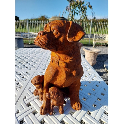 330 - Cast iron model of Pug dog with pups. {30 cm H x 25 cm W x 30 cm D}.