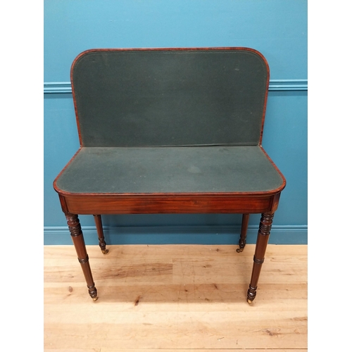 347 - Georgian mahogany and rosewood turn over leaf card table raised on turned legs and brass castors {73... 