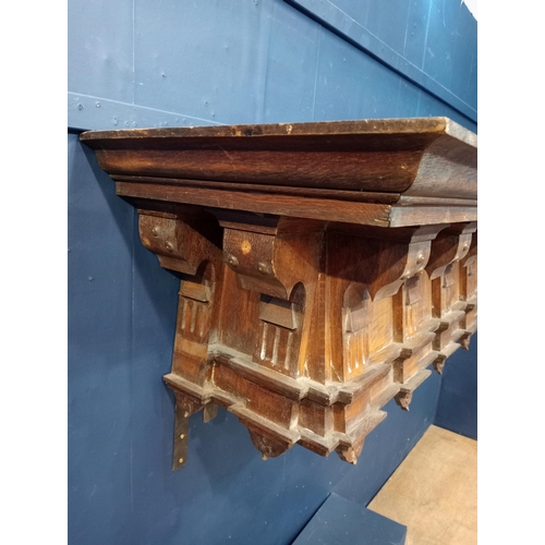 354 - Oak carved fireplace mantle in the Arts and Crafts manner. {H 52cm x W 167cm x D 56cm}.