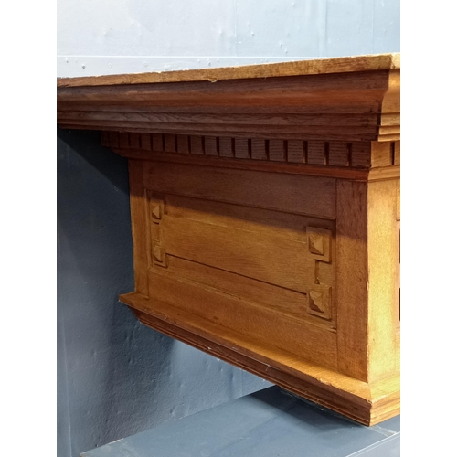 354A - Oak carved fireplace mantle in the Arts and Crafts manner. {H 62cm x W 230cm x D 112cm}.