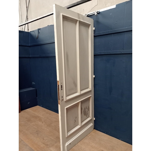 359 - Oak four panelled door- divider painted one side. {H 216cm x W 93cm x D 7cm }.