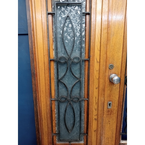 362 - Victorian Oak double door with wrought iron scrolled insert and frame {H 202cm x W 150cm x D 6cm}.