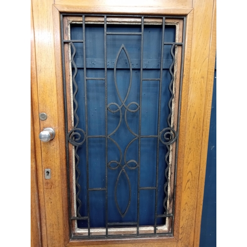 362 - Victorian Oak double door with wrought iron scrolled insert and frame {H 202cm x W 150cm x D 6cm}.