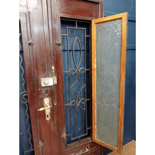 362 - Victorian Oak double door with wrought iron scrolled insert and frame {H 202cm x W 150cm x D 6cm}.