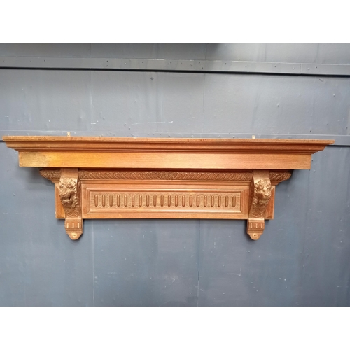 385 - Victorian Oak shelf with hand carved lion corbels {H 50cm x W 142cm x D 21cm }.