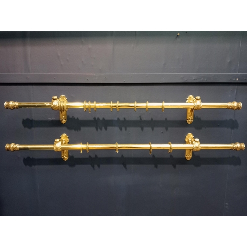 419 - Pair of brass curtain rails with acanthus leaf design {Each H 16cm x W 124cm x D 14cm}.