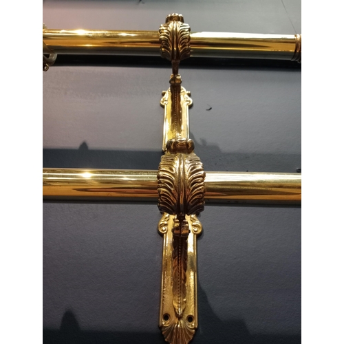 419 - Pair of brass curtain rails with acanthus leaf design {Each H 16cm x W 124cm x D 14cm}.