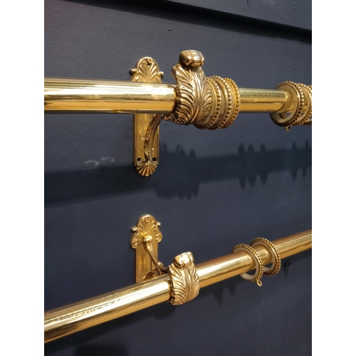 419 - Pair of brass curtain rails with acanthus leaf design {Each H 16cm x W 124cm x D 14cm}.