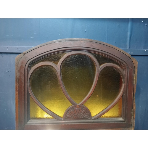 42 - Mahogany arched fanlight with coloured glass insert. {H 63cm x W 80cm x D 4cm }.