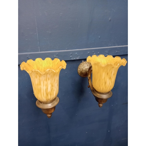 422 - Pair of brass wall lights with tulip shades {H 23cm x W 25cm x D 30cm}.