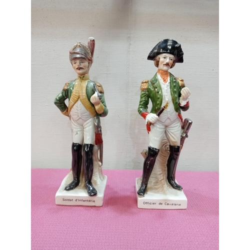 424 - Pair of Capodimonte soldier figures. {H 23cm x W 6cm x D 6cm }.