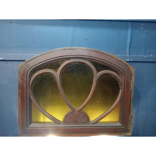 43 - Mahogany arched fanlight with coloured glass insert. {H 66cm x W 84cm x D 19cm}.