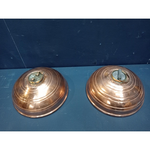 430 - Pair of copper foot warmers {H 10cm x Dia 21cm}.