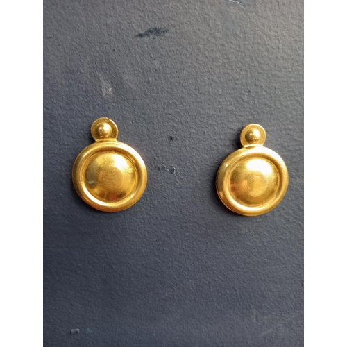 431 - Pair of covered Victorian brass escutcheons. {D 3cm}.