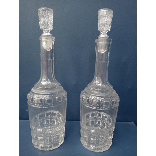 432 - Pair of cut glass decanters. {H 32cm x Dia 8cm }.