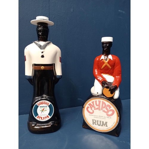 433 - Pair of decorative rum bottles - Calypso and Barbados {H 26cm }.