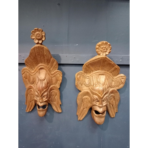 449 - Pair of large wooden hand carved African tribal masks. {H 43cm x W 27cm x D 10cm }.