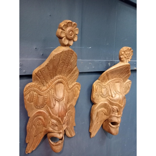 449 - Pair of large wooden hand carved African tribal masks. {H 43cm x W 27cm x D 10cm }.