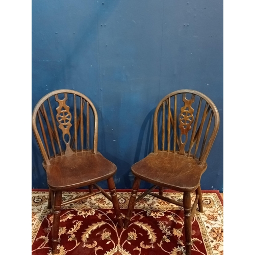 469 - Pair of early 20th C. oak wheel back chairs {H 89cm x W 43cm x D 40cm}.