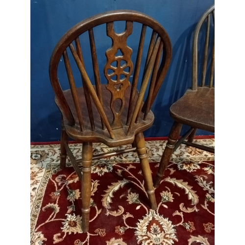 469 - Pair of early 20th C. oak wheel back chairs {H 89cm x W 43cm x D 40cm}.