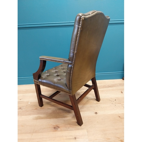 47 - Deep buttoned leather Gainsborough arm chair in the Georgian style {105 cm H x 60 cm W x 65 cm D}.
