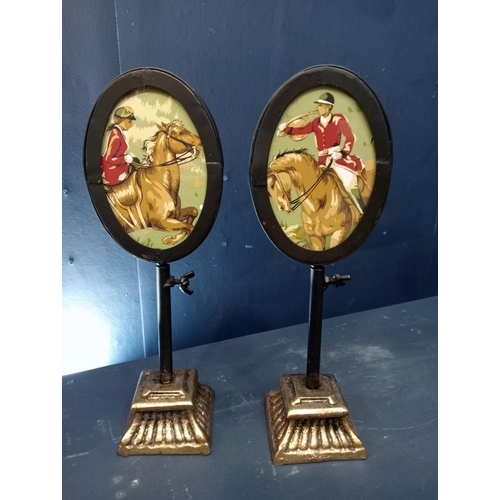 471 - Pair of adjustable oval picture framed pole screens. {H 28cm x W 10cm x D 7cm}.