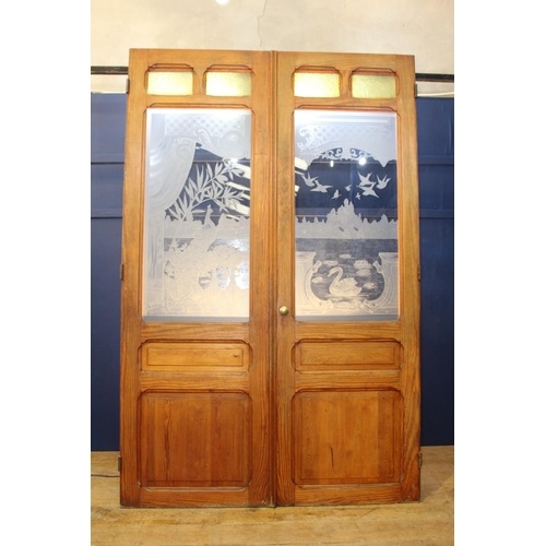 476 - Pair of pitch pine doors with etched glass depicting a scene of balcony with birds {H 243cm x W 80cm... 