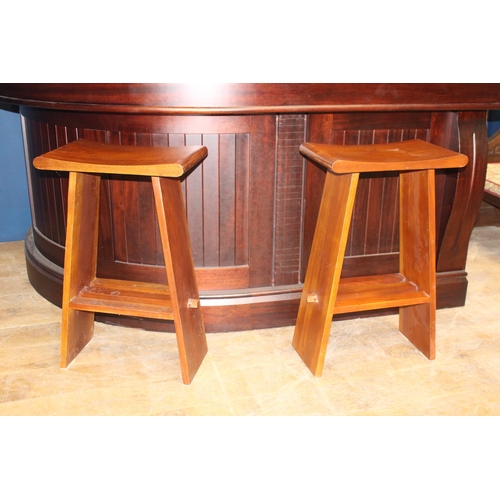 486 - Pair of teak dished seat high stools  {H 82cm x W 50cm x D 30cm}.