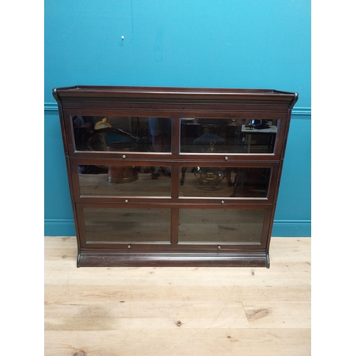 487 - 1940s mahogany stackable bookcase with folding glazed doors {113 cm H x 139 cm W x 36 cm D}.