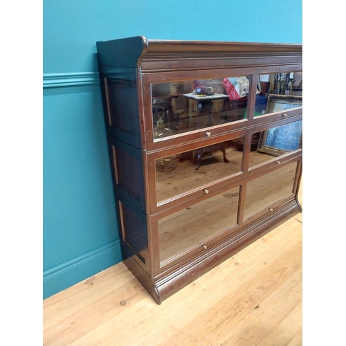 487 - 1940s mahogany stackable bookcase with folding glazed doors {113 cm H x 139 cm W x 36 cm D}.