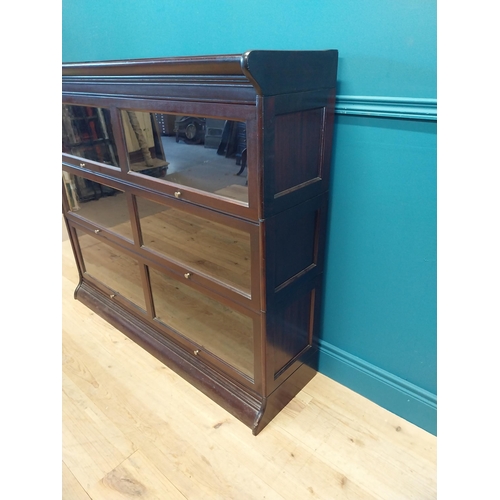 487 - 1940s mahogany stackable bookcase with folding glazed doors {113 cm H x 139 cm W x 36 cm D}.