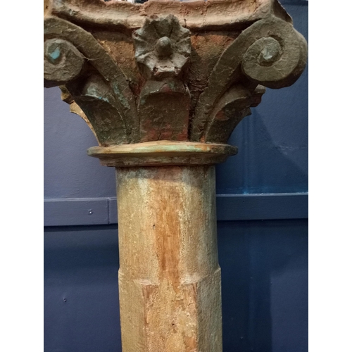 493 - Pair of wooden pillars with Corinthian wood top on sandstone base {H 220cm x W 30cm x D 30cm }.