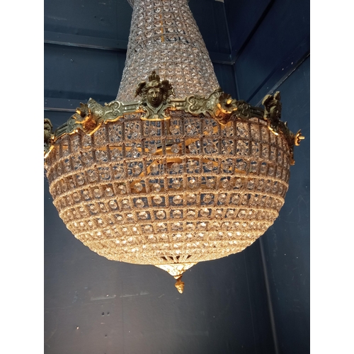 496 - Pear drop Crystal and  bronze six light chandelier {H 100cm x Dia 60cm}.