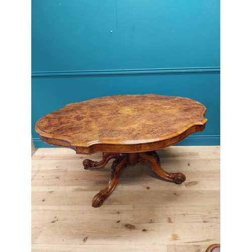 517 - Good quality Victorian burr walnut tilt top centre table raised on turned column and four outswept f... 