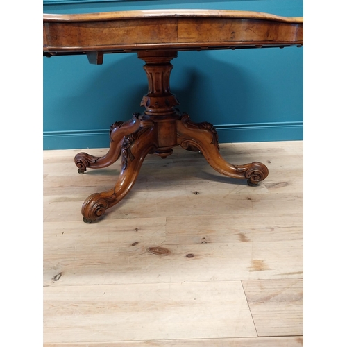 517 - Good quality Victorian burr walnut tilt top centre table raised on turned column and four outswept f... 