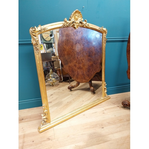 527 - Decorative gilt overmantle mirror in the Rocco style {137 cm H x 130 cm W}.