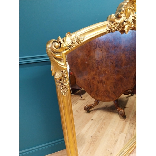 527 - Decorative gilt overmantle mirror in the Rocco style {137 cm H x 130 cm W}.