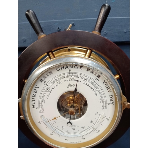 539 - Schulz compensated barometer and matching clock in ships wheel surround {D 10cm x Dia 33cm }.