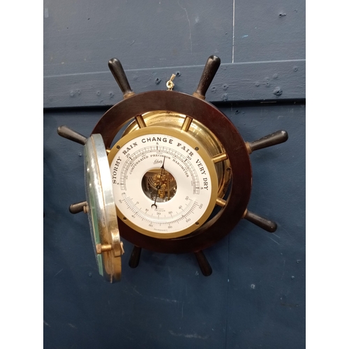 539 - Schulz compensated barometer and matching clock in ships wheel surround {D 10cm x Dia 33cm }.